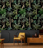 Yellow chair and credenza against jungle foliage wallpaper, green palms on a black ground