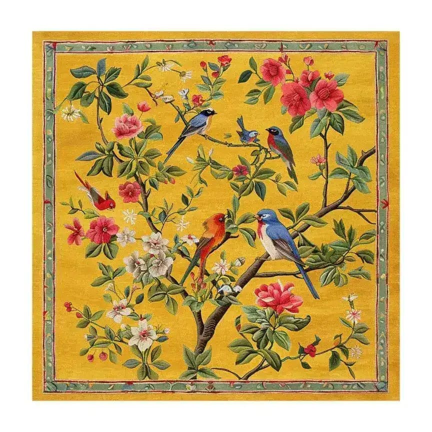 A vibrant square area rug featuring a lively floral design with birds perched on branches set against a rich yellow background. This wool rug is perfect for adding a splash of color to your living room, fitting comfortably as a living room rug 8x10. The intricate floral pattern makes it an ideal floral rug for those seeking a unique and eye-catching square area rug.
