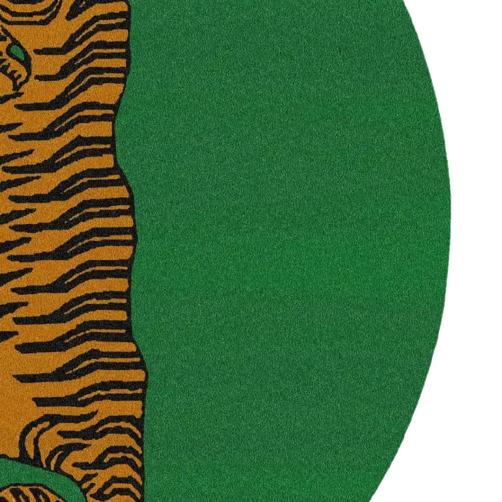 Close-up view of the Yellow Tibetan Tiger Green Hand Tufted Round Rug, showcasing the intricate tiger design in warm tones against a lush green backdrop. This wool area rug is perfect for adding a bold statement to your living room or dining room, making it an ideal area rug for under a dining table.