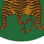 Close-up of a Yellow Tibetan Tiger design on a Green Hand Tufted Round Area Rug, showcasing intricate wool patterns perfect for a living room or dining room setting.