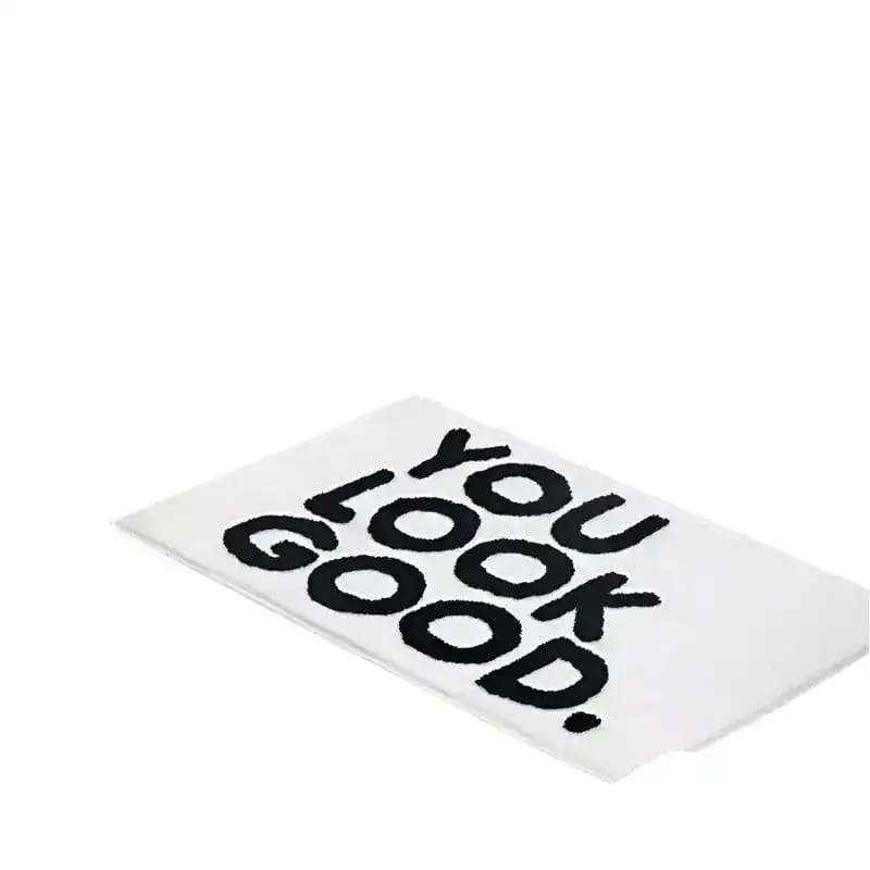 Stylish 'You Look Good' area rug with bold black text on a white background, perfect for adding a playful touch to rugs for living room or living room area rugs.