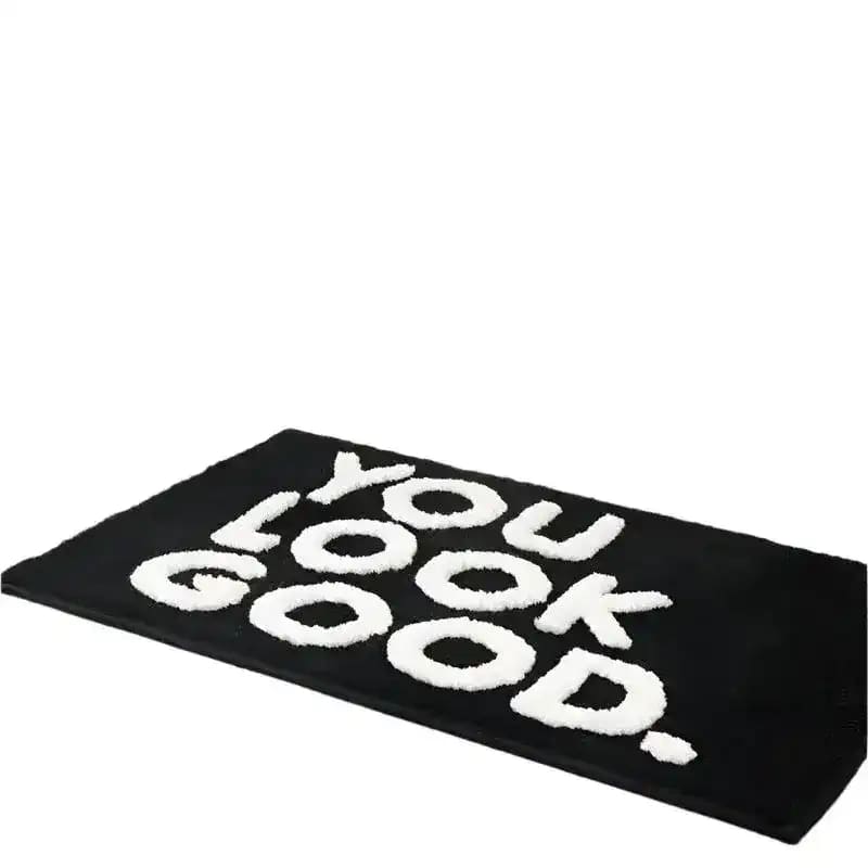 Stylish black area rug featuring bold white text saying 'You Look Good', perfect for adding a modern touch to rugs for living room or as a standout living room area rug.