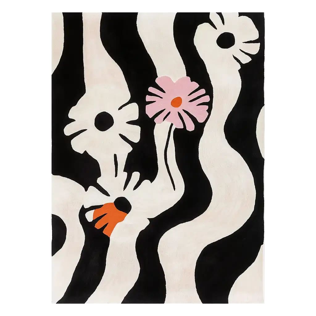 Contemporary area rug featuring a bold black and white zebra stripe pattern with abstract floral accents in pink and orange, ideal for adding a touch of modern style to your living room. This hand-tufted wool rug is perfect for those seeking unique living room area rugs.