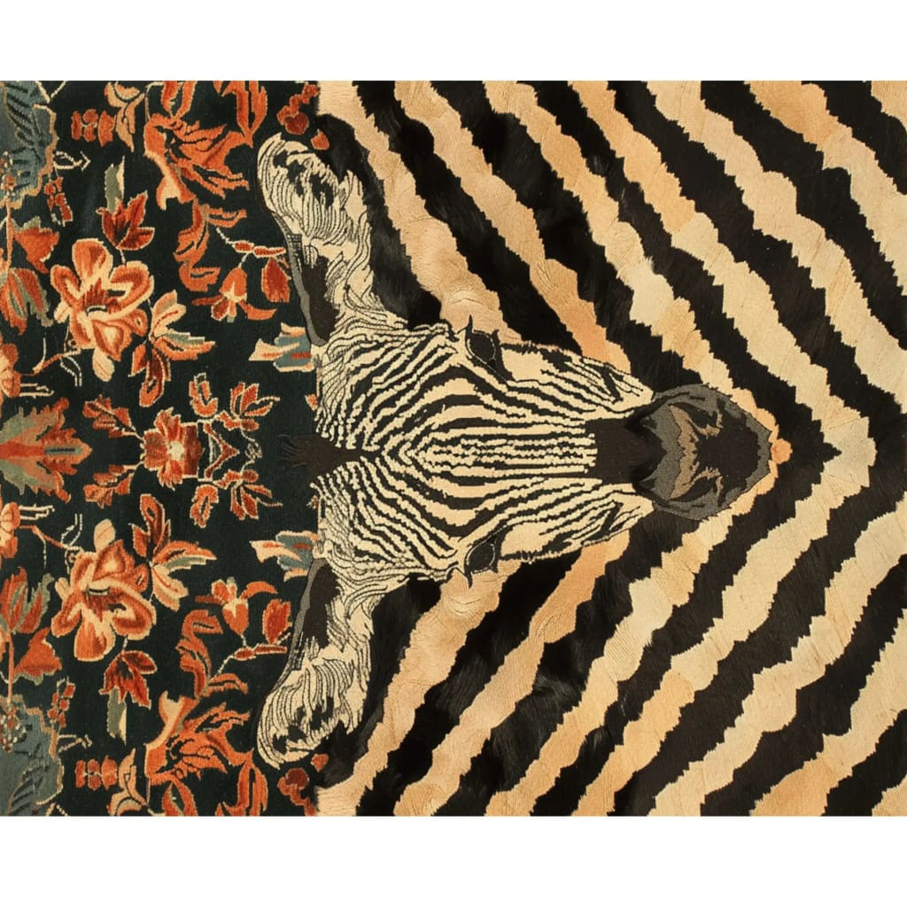 This stunning Zebra Fusion Hand Tufted Area Rug features a bold zebra stripe pattern in black and beige, beautifully complemented by intricate floral designs in rich reds and greens. Perfect as a large area rug for the dining room or under a dining table, this wool rug adds a vintage touch to any space.