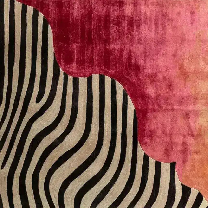 A contemporary area rug featuring bold zebra stripes contrasting with a rich, red background. This wool rug is perfect for enhancing the modern aesthetic of living rooms or bedrooms, offering a unique touch as a bedroom area rug.