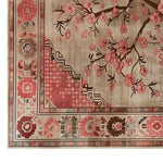 A beautifully detailed Zen Blooms Hand Tufted Wool Rug featuring an intricate floral pattern with pink blossoms against a soft beige background. Perfect for adding a touch of elegance to living room spaces, this area rug measures 8x10 and offers the warmth and softness of a wool rug.