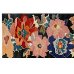 Vibrant Zenith Bloom Hand Tufted Wool Rug featuring a colorful floral design, perfect as a runner rug for kitchens, hallways, or bathrooms. This wool rug offers a striking blend of reds, blues, and pinks, adding a touch of elegance to any space.