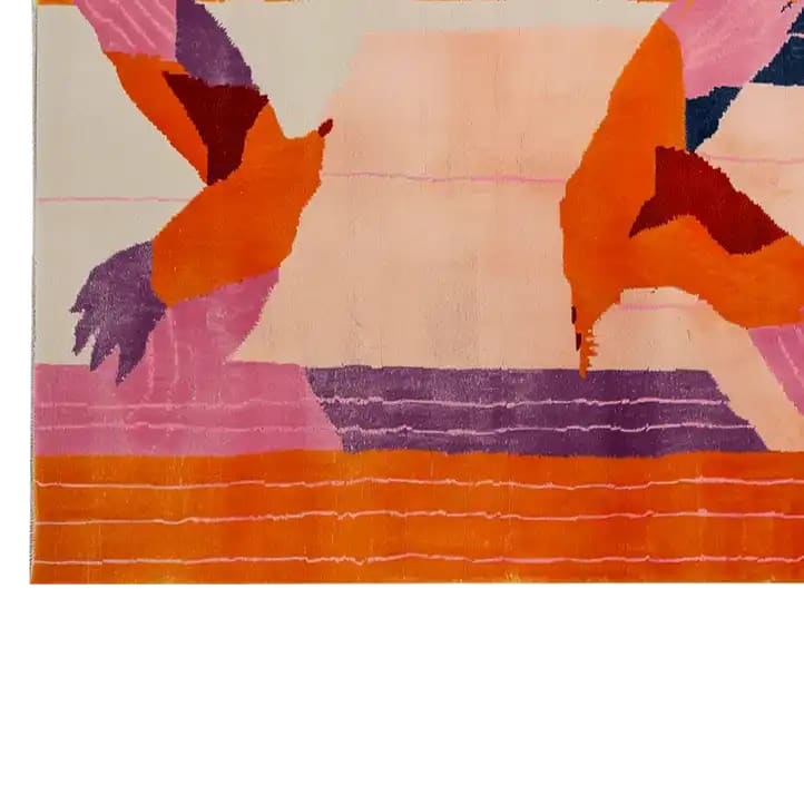A vibrant Zenith Bloom Hand Tufted Wool Rug featuring bold abstract patterns in shades of orange, pink, and purple. This visually striking 8x10 area rug is perfect for adding a touch of modern art to your living room decor, showcasing the luxurious texture of wool.