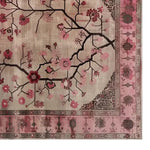 A beautifully detailed area rug featuring a floral design with branches and blossoms in pink and red hues, perfect for an 8x10 living room space. This Zenwood Sanctuary Knotted Wool Rug adds elegance to any living room area, enhancing the ambiance with its intricate patterns.