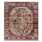 The Zenwood Sanctuary Knotted Wool Rug is a stunning area rug featuring a delicate floral design in shades of pink and beige, perfect for enhancing any living room. This 8x10 living room rug showcases intricate patterns and a vibrant floral motif, making it a charming addition to your home decor.