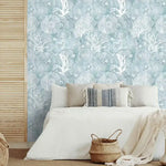 Abstract coastal cottage wallpaper featuring sea creatures and coral designs in soft blue and white tones, ideal for beach-themed interiors.