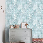 Abstract coastal cottage wallpaper featuring sea creatures and coral patterns in soothing blue tones, ideal for enhancing marine-themed interiors.