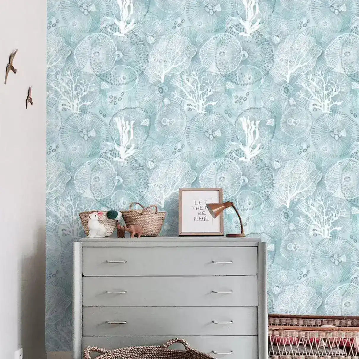 Abstract coastal cottage wallpaper featuring sea creatures and coral patterns in soothing blue tones, ideal for enhancing marine-themed interiors.