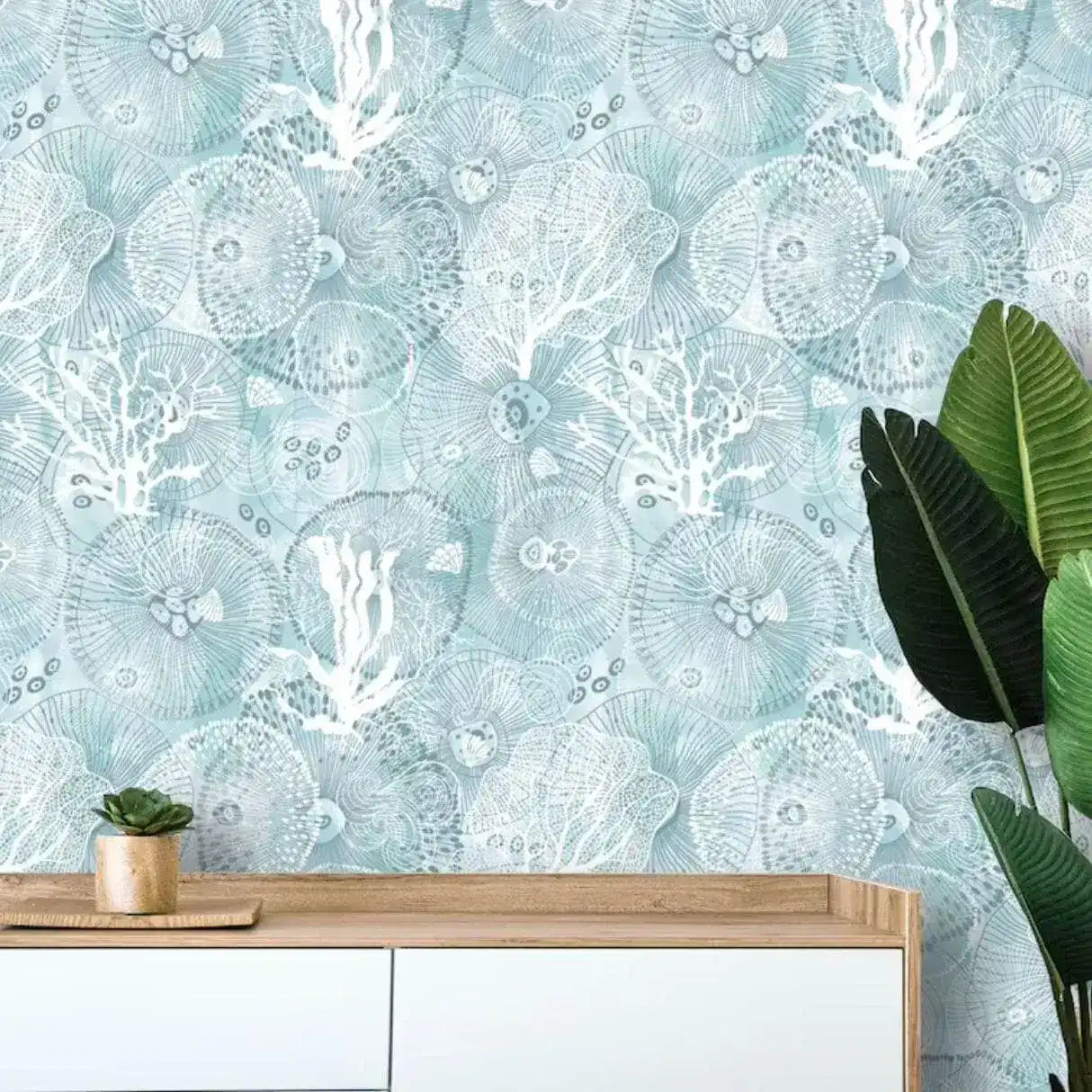 Abstract coastal cottage wallpaper featuring intricate sea creature designs in soft blue and white tones, perfect for a serene seaside ambiance.