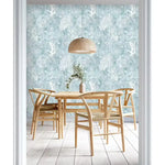 Abstract coastal cottage wallpaper featuring sea creatures and coral designs in soft blue tones, perfect for beach-themed interiors.