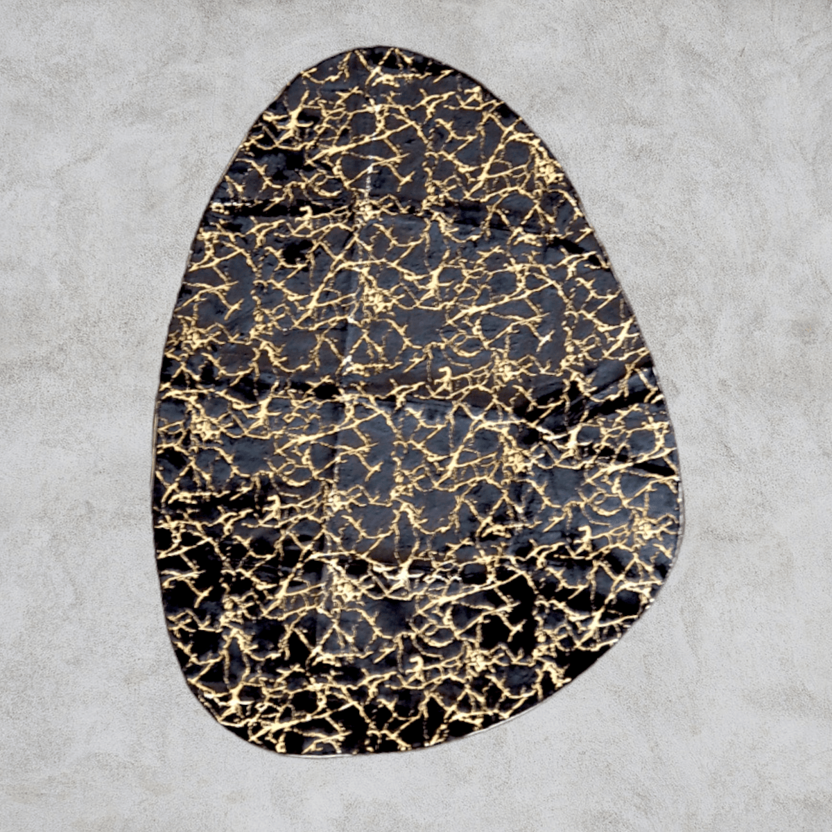 Abstract Gold Gilded Pebble Accent Rug Black