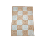 Top view of a Classic Checker Jute Rug in natural color, featuring a checkered pattern perfect for large area rugs. Ideal for adding a touch of elegance to your living room, this 8x10 area rug blends seamlessly with various decor styles. Perfect for those seeking durable jute rugs for their living space.