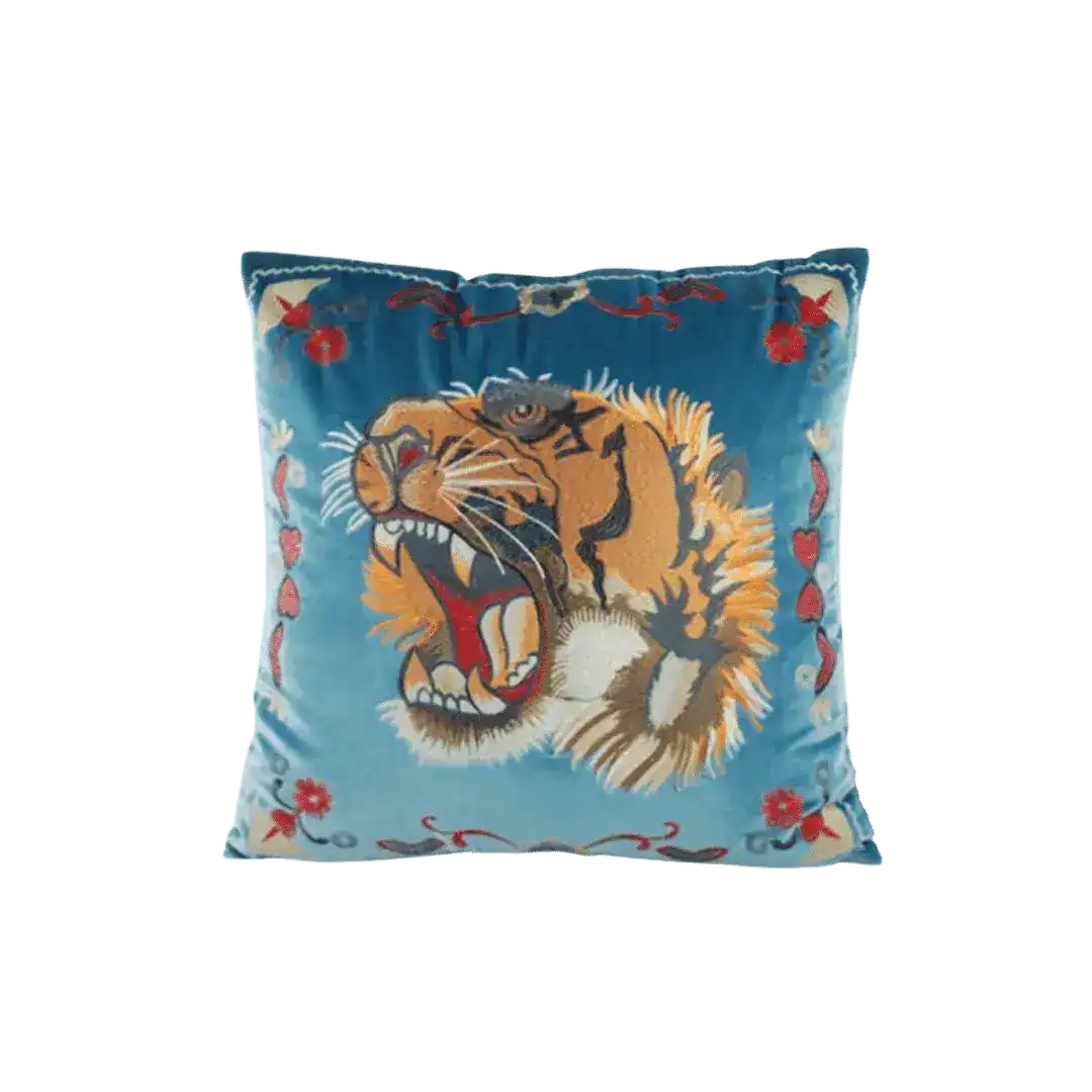 Embroidered decorative throw pillow cover featuring a vibrant screaming tiger design on a blue background, adorned with floral accents.