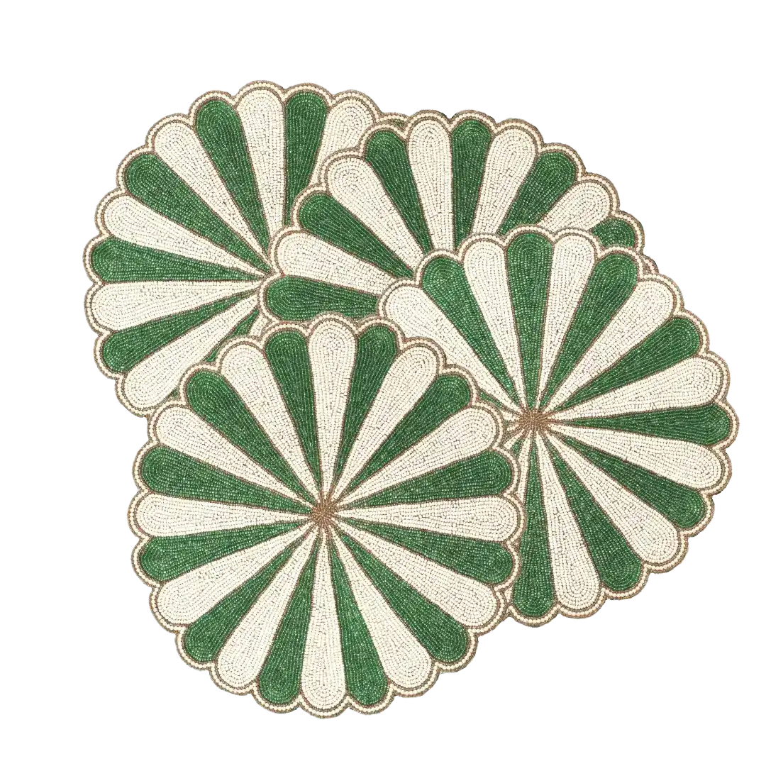 Three green and white beaded scallop round placemats overlapping in triangular cluster on gray background