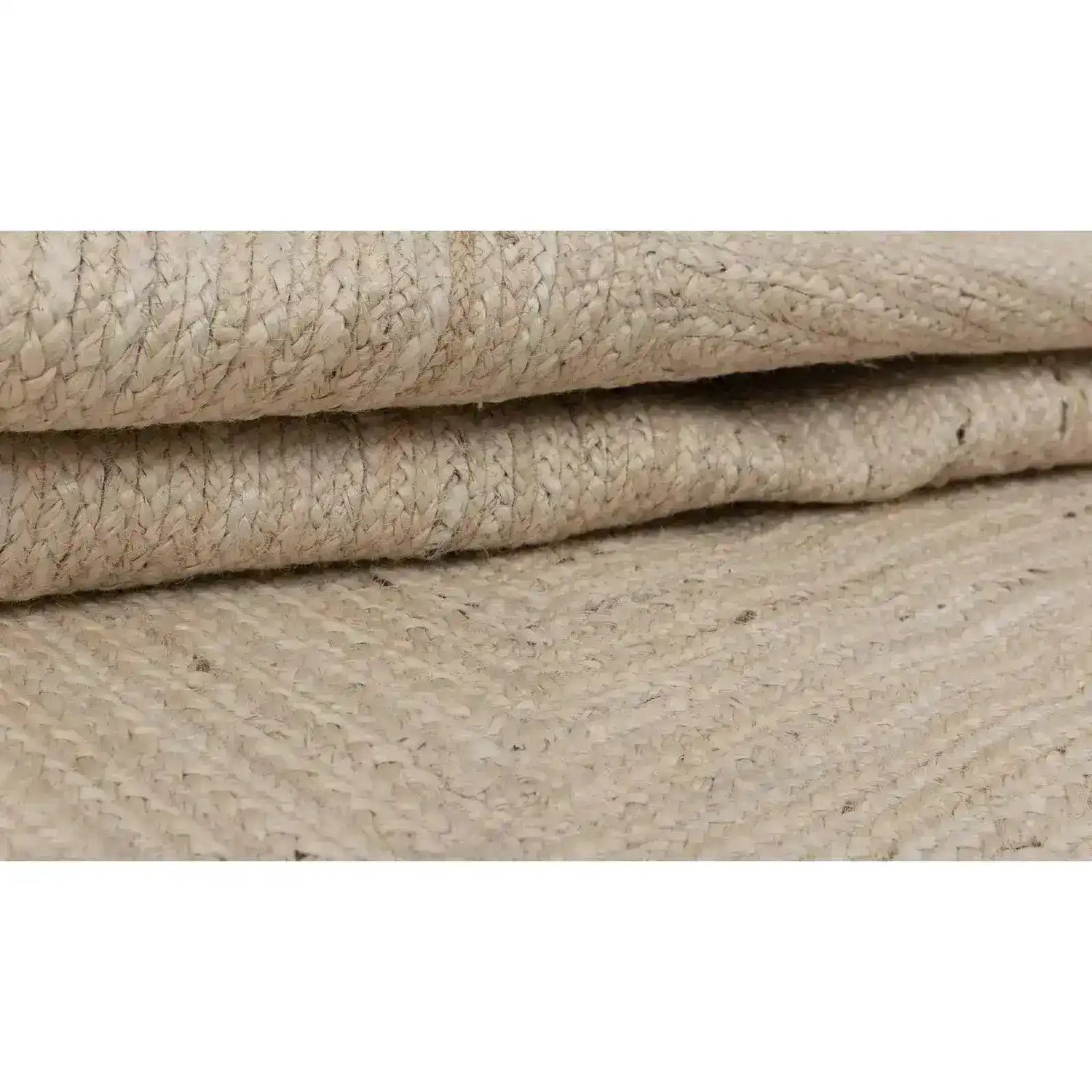 Close-up view of a Handmade Scalloped Jute Rug in a soft white wash finish, showcasing its intricate woven texture. Ideal for enhancing boho decor, this area rug is perfect for living rooms and available in various sizes, including 8x10.