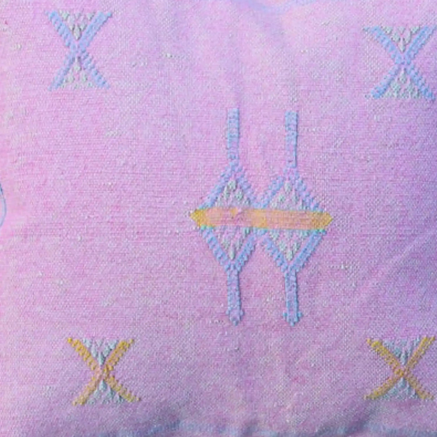Handwoven pink decorative throw pillow cover featuring intricate geometric patterns in blue and yellow tones, perfect for adding a touch of elegance to your home decor.